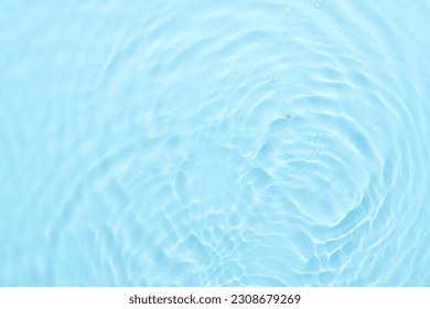 Water blue surface abstract background. Waves and ripples of cosmetic moisturizer with bubbles - Powered by Shutterstock