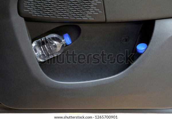 water\
bottles in the car\'s door storage\
compartment