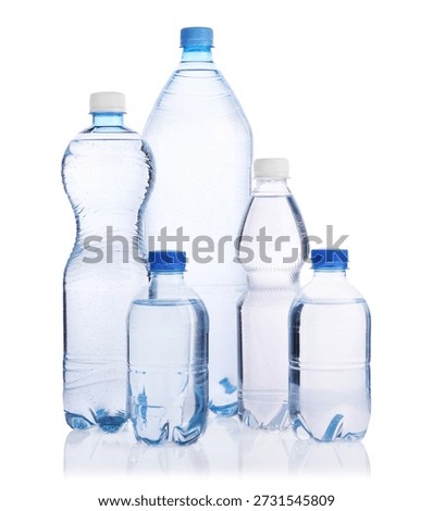 Water bottles of different sizes isolated on white
