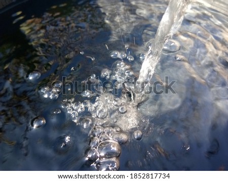 water bubbles from the water tap.
