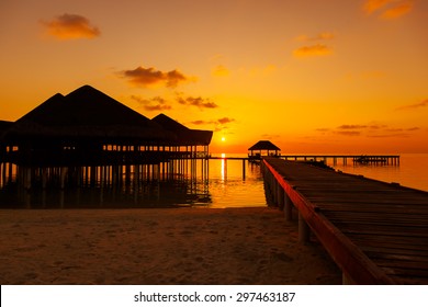 Water cafe at sunset - Maldives vacation background