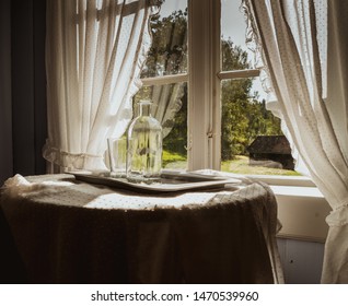 Water Carafe And A Glass On The Table