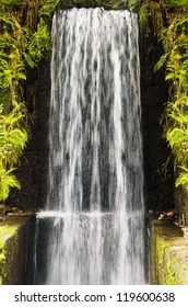 Water Cascade Falls From A High Wall