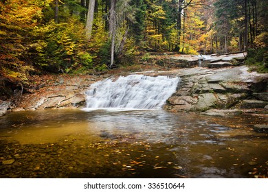 Water cascade on Mumlava stream in autumn forest of Giant Mountains, Czech Republic. - Shutterstock ID 336510644