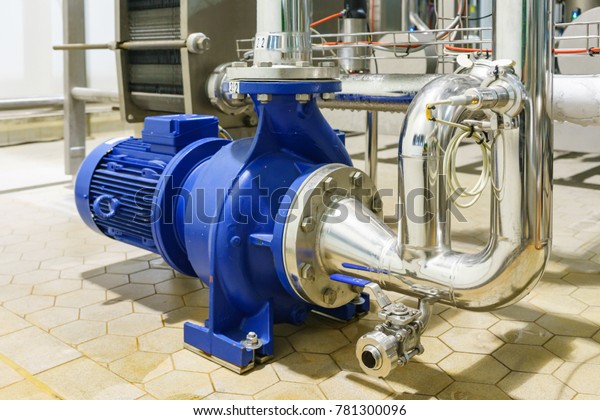 Water\
Centrifugal pump and motor line with pipe rack in power plant\
construction site industrial, demineralized\
water