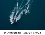 Water competitions on the water. Travel - image. Boat and water scooter parallel movement on the water aerial view. 