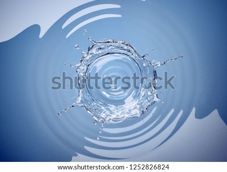 Water crown splash with ripples viewed from top.