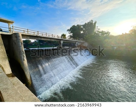 Water dam with strong current under the bridge