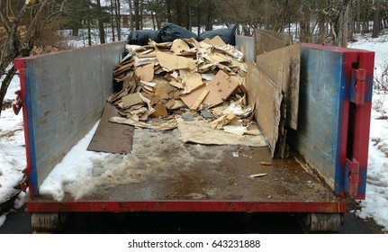 Water Damage Restoration Debris In Dumpster