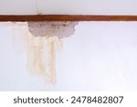 Water damaged ceiling roof, brown stain, office building