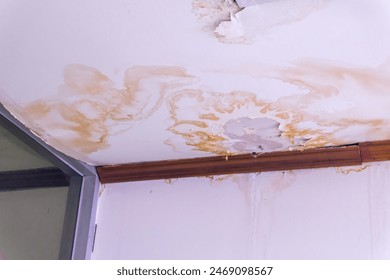 Water damaged ceiling roof, brown stain, office building