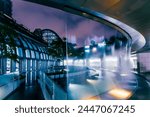 Water dance performance of the outdoor music fountain cloister in an autumn evening at the Daan Forest Park Station, Taipei MRT, Taiwan.