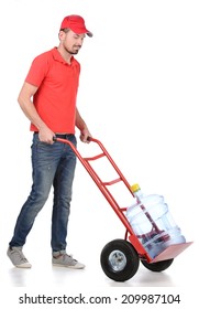 Water Delivery. Cheerful Young Deliveryman Holding A Water Jug While Isolated On White