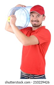 Water Delivery. Cheerful Young Deliveryman Holding A Water Jug While Isolated On White