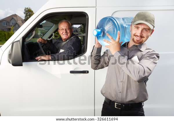 Water delivery\
service man with big bottle.\
