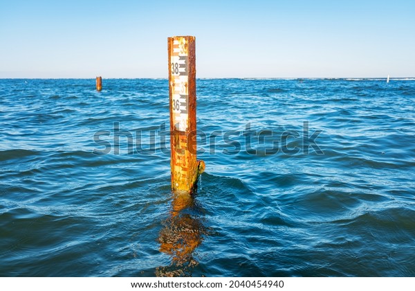Water depth\
measurement tool or sea level marker.Observation of the water level\
scale to prevent floods and\
disasters
