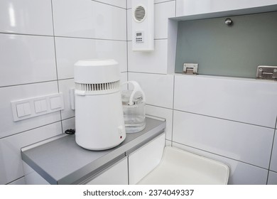 Water distiller in a dental clinic. Ensuring uninterrupted production of water purified from impurities for dental purposes. Equipment in a medical facility, dental water distiller