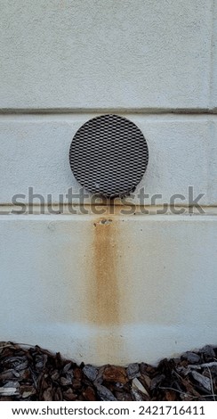 water drain or air conditioning screen with rust stain