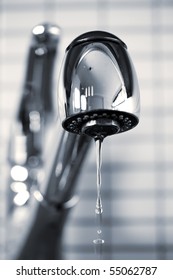 Water Dripping From Stainless Steel Kitchen Faucet