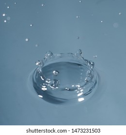 water drop, blue color, just in the splash moment