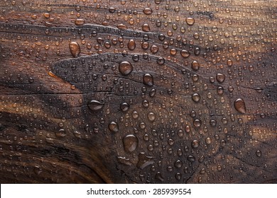 water drop in burn wooden background