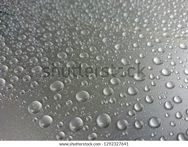 Water drop on a car\
hood
