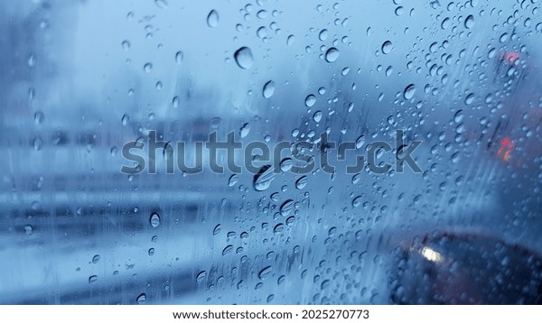 Water drop on car window in\
winter