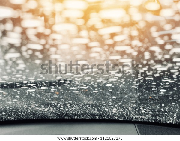 Water drop on mirror car with\
traffic jam background, raining seasonal, bad moody ,alone\
concept