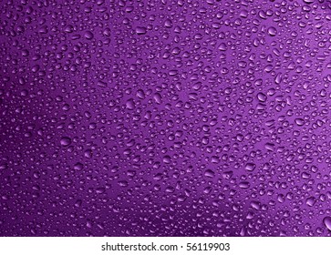 Water Drop In Purple Background