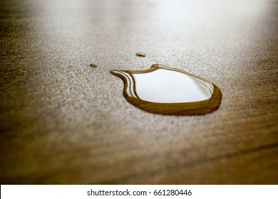 Water Drop And Reflection On Laminate Floor