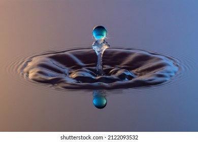 Water drop resembling a little martian coming out of the water