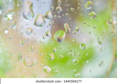 Water Droplet Dripping Down Glass