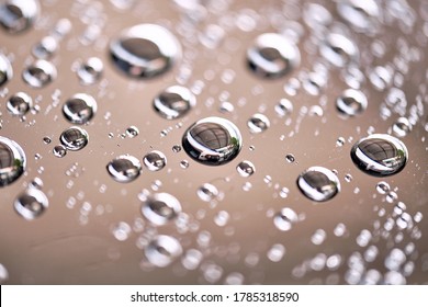 Water Droplet On The Car Hood. Water Beading After Rain Or Car Wash On Black Shiny Paint Surface. Beading Created By Ceramic Coat Or Paint Sealant With High Surface Tension. Water Drop Background.