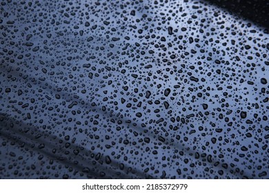 Water Droplets After Raining Fall On Front Light Blue Silver Color Car Bonnet Texture Background