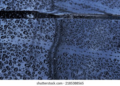 Water Droplets After Raining Fall On Front Light Blue Silver Color Car Bonnet Texture Background