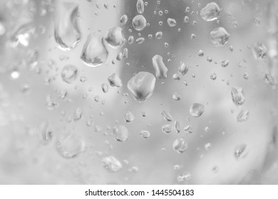 Water Droplets Dripping Down Glass