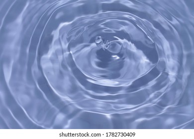 
Water droplets falling on the light blue water Creating small waves - Shutterstock ID 1782730409