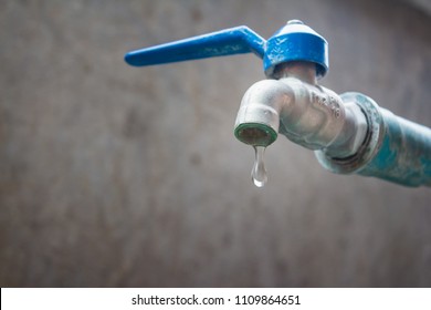 Water Droplets Faucet, Concept Drought And Crisis Environment.