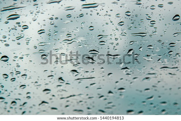Water droplets on\
auto glass as background