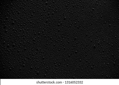 Water Droplets On Black Background And Texture.