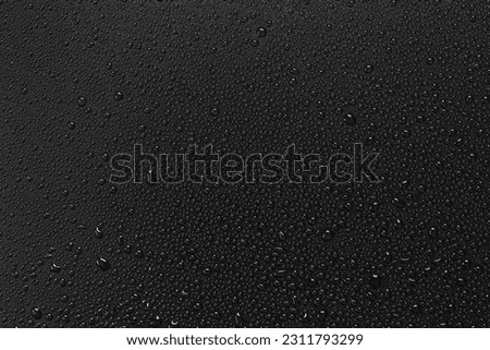 Water droplets on a black background.