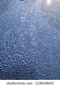 Water droplets on a black surface