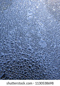 Water droplets on a black surface