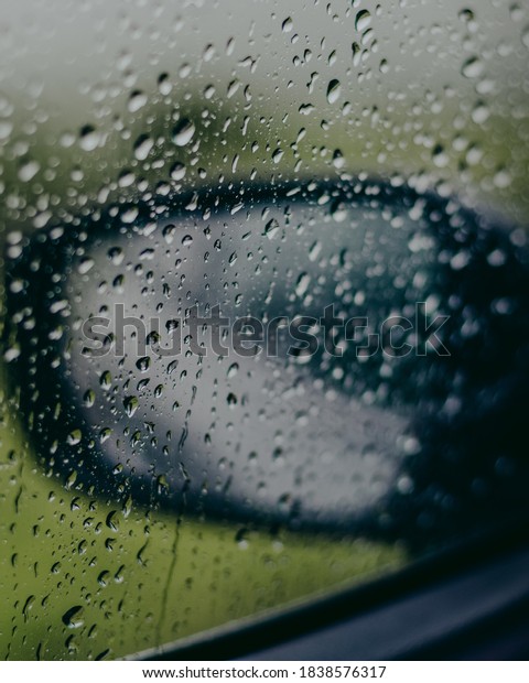 water droplets on the car\
mirror