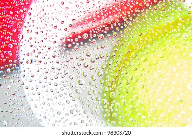 Water droplets on glass with background yellow and red colors - Powered by Shutterstock