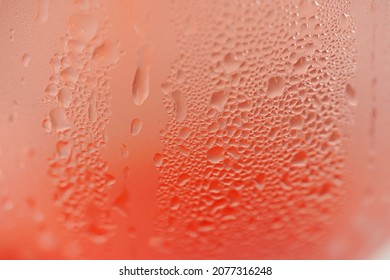 Water droplets on a glass of red cold drink for background and texture. (close up, selective focus, space for text) - Powered by Shutterstock