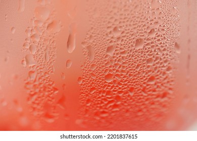 Water droplets on a glass of red cold drink for background and texture. (close up, selective focus, space for text) - Powered by Shutterstock