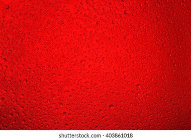 Water droplets on the glass with a red illumination - Powered by Shutterstock