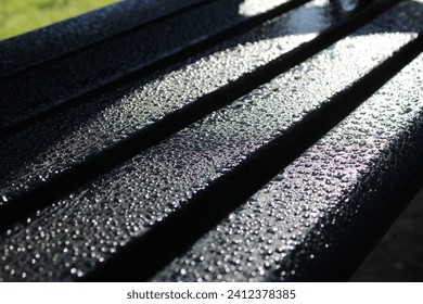 Water droplets on a park bench, Up close picture taken early morning in winter - Powered by Shutterstock