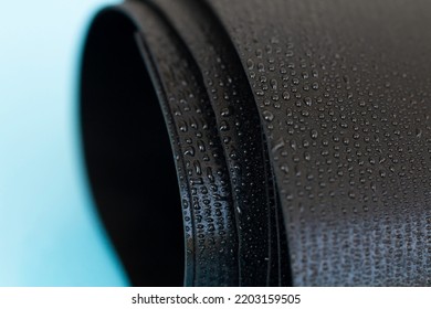 Water Droplets On The Rubber Membrane. Waterproofing...  Close-up Selective Focus Area.